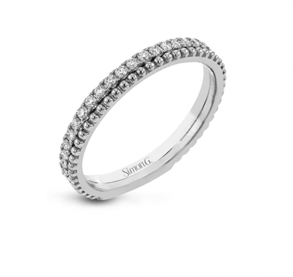 A line of .33 ctw of white diamonds sits alongside a row of granulation in this band that adds the ideal touch of shine. perfect for stacking with other rings.
